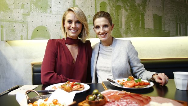 Sylvia Jeffreys, left, and Kate Waterhouse catch-up at Italian Street Kitchen in Neutral Bay.