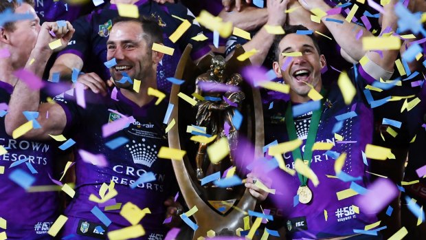 Cameron Smith and Billy Slater with the NRL premiership trophy.