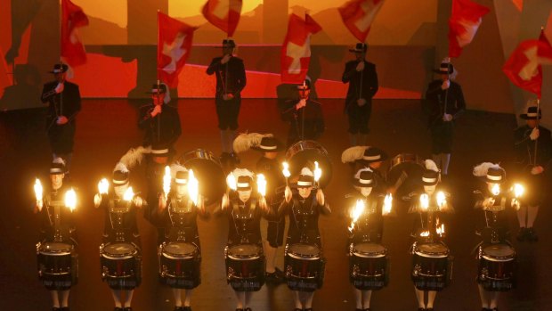 The Top Secret Drum Corps of Switzerland perform during the opening ceremony.