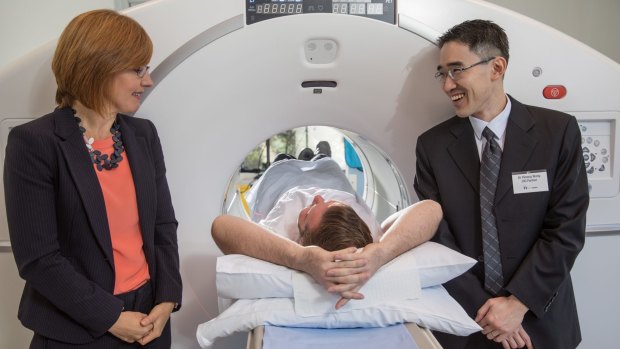 ACT Minister for Health Meegan Fitzharris with CIG radiologist, Will Cole acting as a patient and CIG PET/CT radiologist Dr Yiisong Wong . 