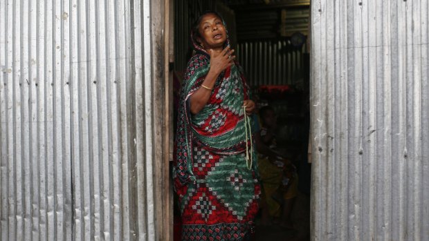 Musammat Khudaja, grandmother of Rubi Akhtar, 12, who died in a stampede, cries at her home.