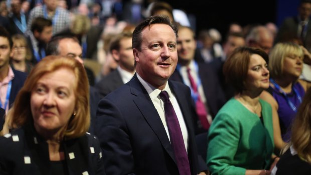 British Prime Minister David Cameron listens to speakers at the Conservative Party conference.