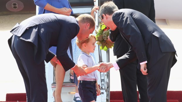Prince William, Duke of Cambridge, and Prince George of Cambridge also engaged in a spot of handshaking during an official visit to Poland and Germany on July 19, 2017 in Berlin, Germany.