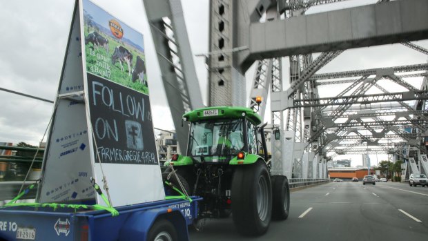 Farmer Gregie crosses the Story Bridge just after noon on Sunday, raising awareness of the importance of supporting local farmers.