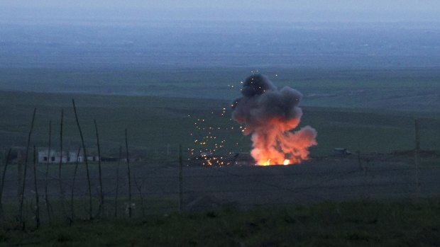 A downed Azerbaijani drone exploding in the separatist region of Nagorno-Karabakh on Monday. 