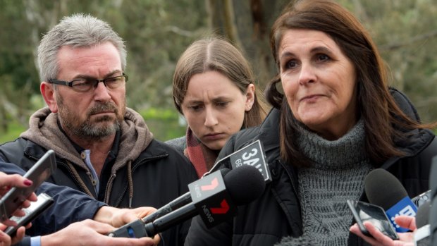 Karen's husband, Borce, their daughter, Sarah, and Karen's aunt Patricia Gray, speak to the media last year.