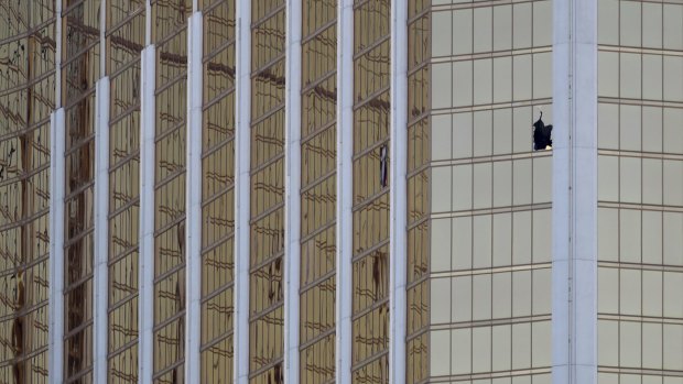 A broken window at the Mandalay Bay resort and casino is seen in the aftermath.
