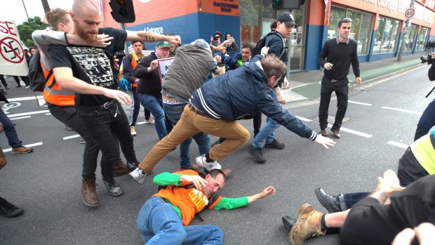 Protesters clash outside a speech by alt-right commentator Milo Yiannopoulos in Kensington