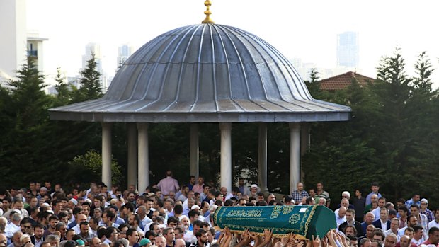 Mourners in Istanbul's Basaksehir district carry the coffin of Muhammed Eymen Demirci, killed in the airport attack.