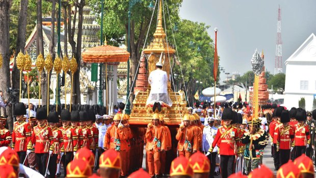 The ceremony began with the transfer of the remains of King Bhumibol Adulyadej to his spectacular golden crematorium on Thursday morning.