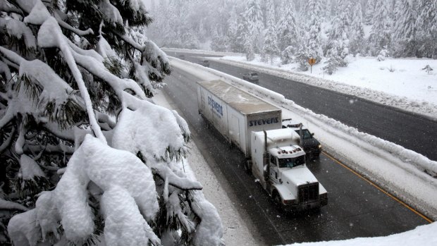 Snow falls of traffic on west bound Interstate 80 near Nyack, California in January of 2010. Scientists estimate that the amount of snow in the Sierra Nevada mountains this year was the lowest it had been in more than 500 years. 