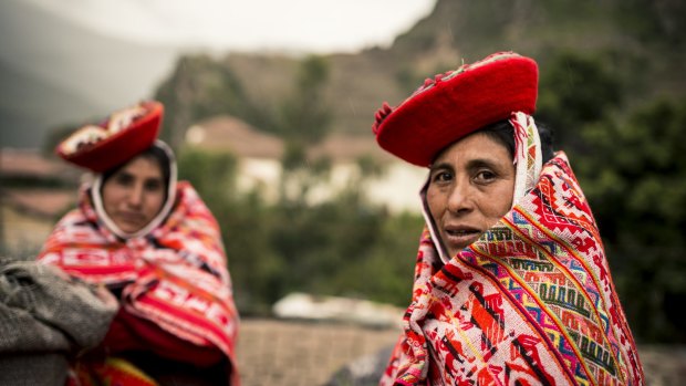  Women wear  traditional dress in Ollantaytambo, Sacred Valley, Peru.
