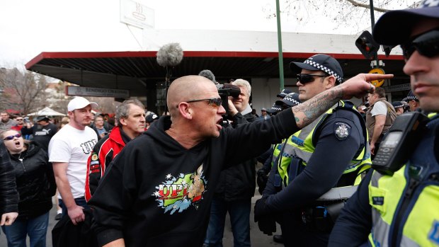 An anti-mosque protester yells over police lines at a rally in August. 