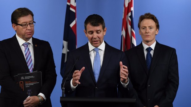 Greyhound ban: NSW Premier Mike Baird, centre, Deputy Premier Troy Grant, left, and CEO of RSPCA NSW Steve Coleman at the announcement on Thursday.