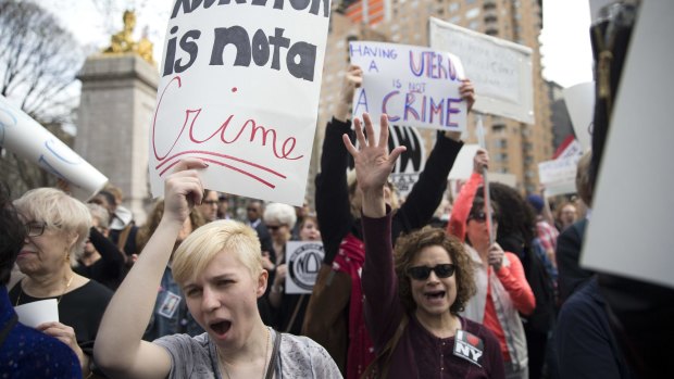 Women rally in New York in March to condemn Republican presidential candidate Donald Trump's remarks about women and abortion.