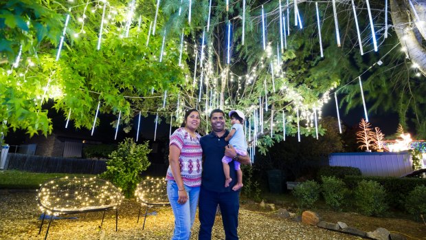 Jessica Michael, Antony Michael and Sophia Michaelson 1 under the christmas lights at Bissenberger Crescent, Kambah.