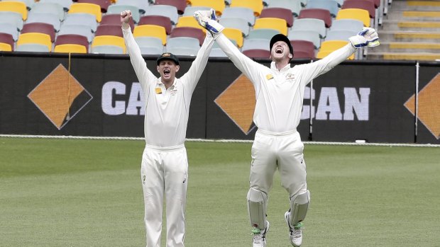 Adam Voges and Peter Nevill celebrate after Australia defeated New Zealand in the first Test.
