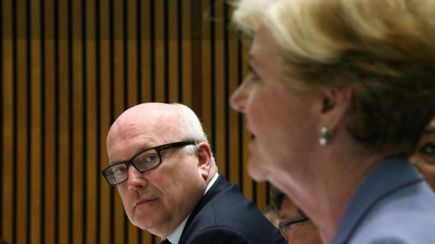 In less-happy times: Attorney-General George Brandis and Gillian Triggs.