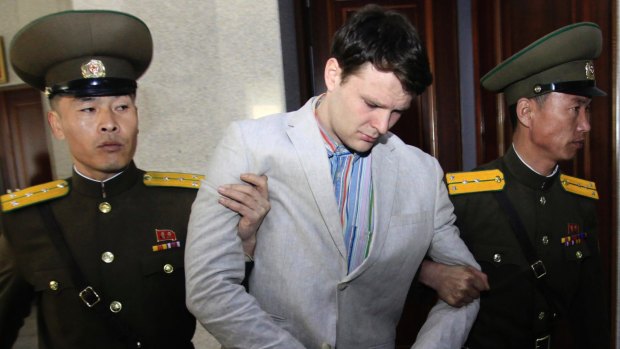 Otto Warmbier, centre, is escorted at the Supreme Court in Pyongyang, North Korea in March 2016.