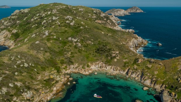 The amphibious vessel takes a break in the clear waters of the Glennie islands.