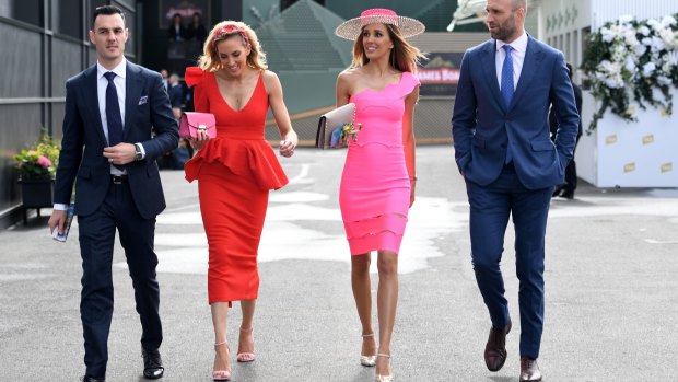 Rebecca Judd and Chris Judd (right) arrive in the Birdcage with Kate Twigley and partner on Melbourne Cup Day.