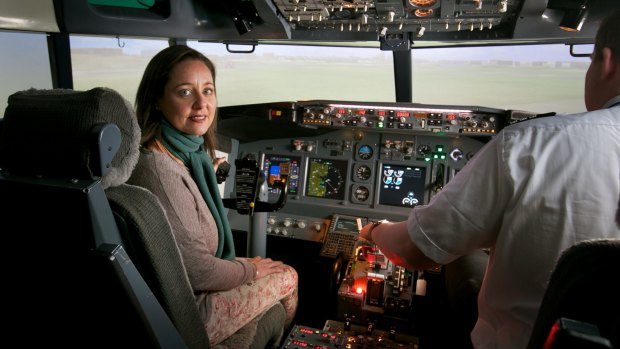 Mastering the fear: Eliza Strauss in a flight simulator with flight instructor Tom Dyke at Flight Experience. 