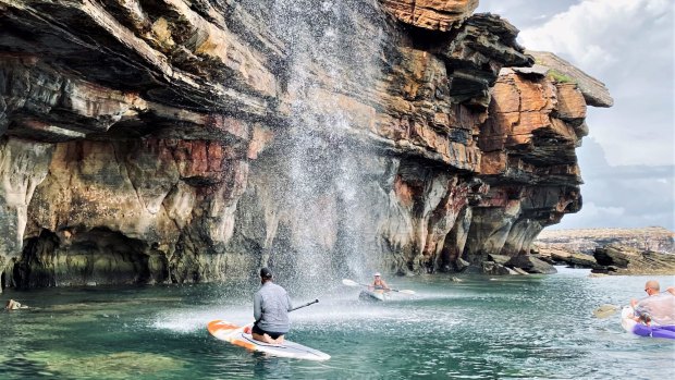 Guests can take kayaks and SUPs beneath waterfalls and beside intricate sandstone cliffs. 