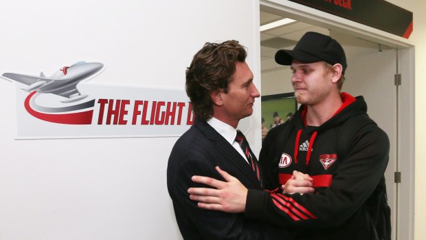 Michael Hurley talks to James Hird after the coach announced his resignation.