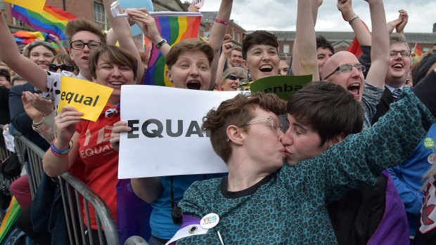 A couple kiss in Dublin Castle Square as the result of the May 2015 referendum is announced.