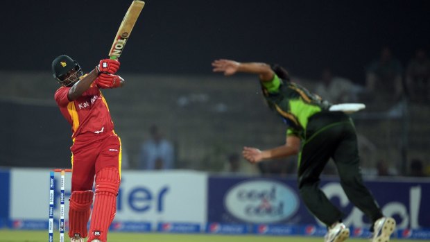 Zimbabwe opener Hamilton Masakadza hits out during the first over, from Pakistan's Anwar Ali, as international cricket returned to Pakistan after six years on Friday.