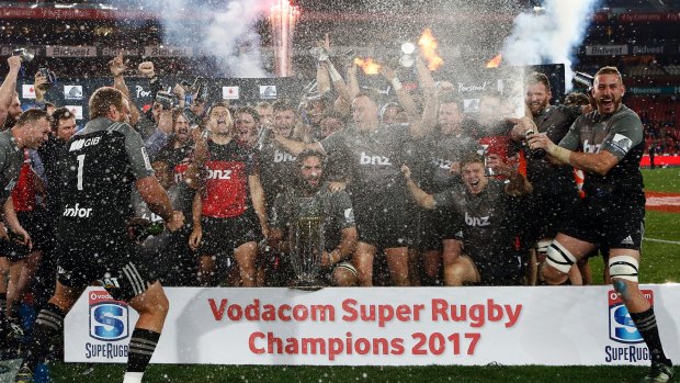 Champions: The Crusaders celebrate their Super Rugby final win against the Lions at Ellis Park.