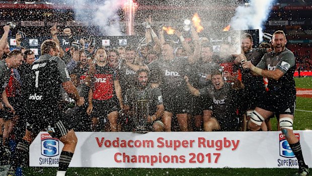 Champions: The Crusaders celebrate their Super Rugby final win against the Lions at Ellis Park.