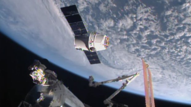 SpaceX Dragon-6 resupply capsule holds at the grapple point, 10 metres from the International Space Station.