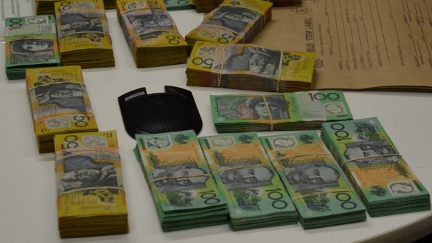 Police seized $260,000 when they arrested Ping He and James Zhu as they left a Neutral Bay apartment in Sydney's north in October, 2014. 