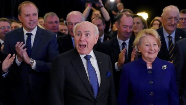 Former prime minister John Howard, pictured with wife Janet, appeared to enjoy the launch more than Tony Abbott.