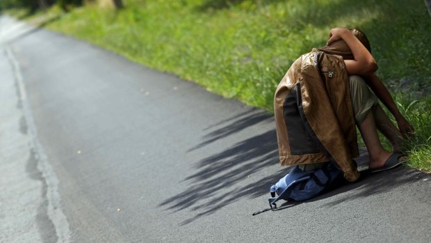 A migrant from Syria rests after crossing illegaly from Serbia into Hungary, near Morahalom on Tuesday.