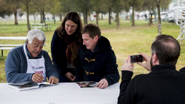 Italian chef Antonio Carluccio makes a star appearance at the Capital Region Farmers Market in Canberra with Julia Kulakoski-Rupert and Steve Muse of Forde.
