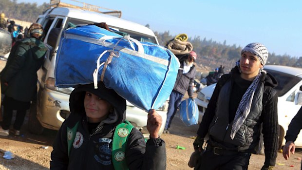 A young boy is evacuated from Aleppo on Monday.