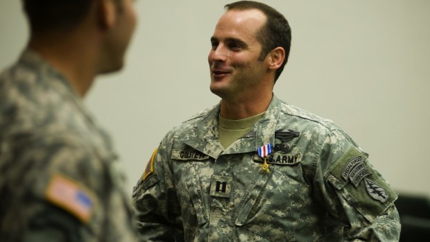 In this photo taken in 2011, US Army Captain Mathew Golsteyn is congratulated by fellow soldiers following the Valor Awards ceremony for 3rd Special Forces Group at Fort Bragg.