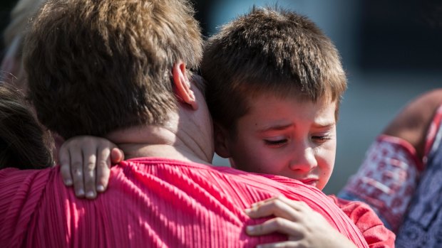 A woman hugs a boy following a shooting at Townville Elementary, South Carolina, on Wednesday.