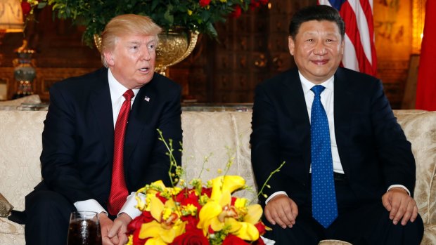 US President Donald Trump, pictured with Chinese President Xi Jinping at Mar-a-Lago in Florida, is cutting overseas funds in the name of "America First". 