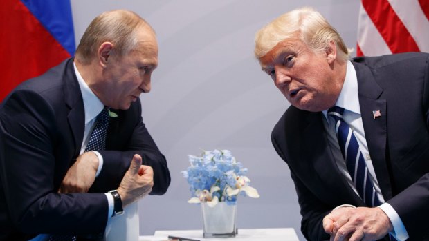 Vladimir Putin meeting with Donald Trump in July.