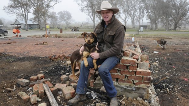Craig Starr, with dog Jenny, at Gold Creek Station, Hall, on the site of the tourist function centre that was destroyed by fire.