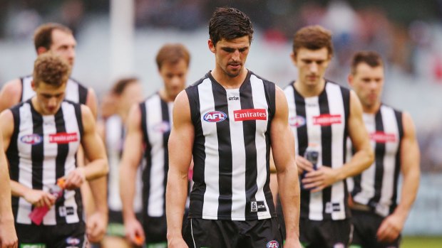 Scott Pendlebury leads his dejected Magpies from the MCG.