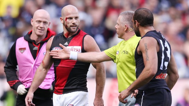Bloody confrontation: Paul Chapman (left) and Chris Yarran.