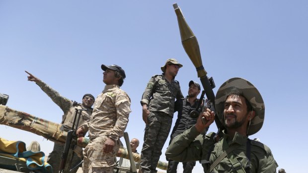 Fighters from the Shiite  Badr Brigades militia. Members of the group, closely linked to Iran,  accuse the US of providing Islamic State with weapons and rations.