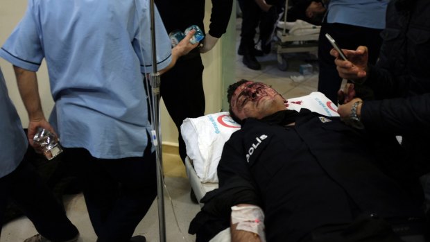 A wounded police officer at an Istanbul hospital after the blasts.