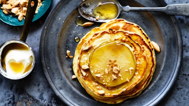 Thick pancakes with toasted almond and pear.