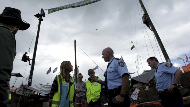 Face-off: Police talk to protesters on the outskirts of Lismore in May. 