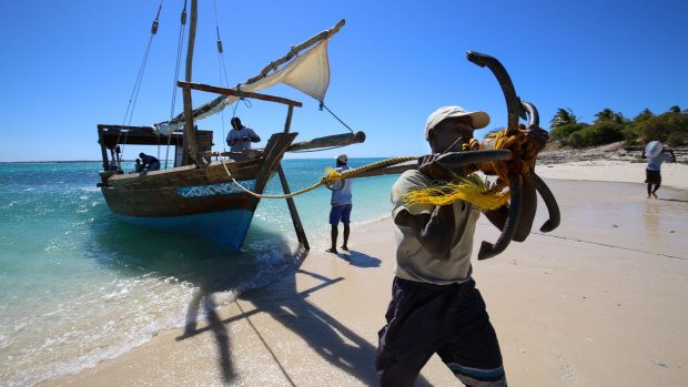 The dhow anchors on Mogundula Island's beach, in the Quirimbas Archipelago, Mozambique.